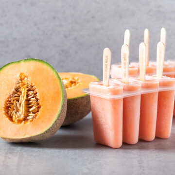 Homemade frozen popsicles made from fresh cantaloupe melon. Healthy summer snack. Selective focus.